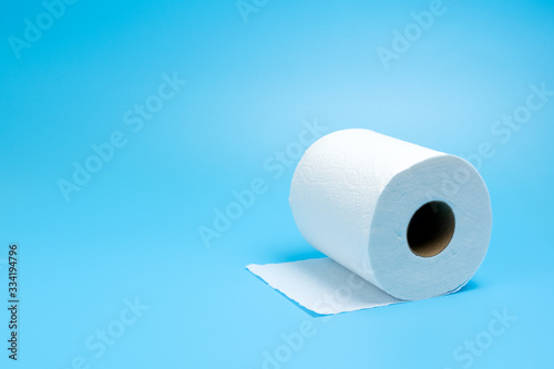 One toilet paper roll isolated on blue background