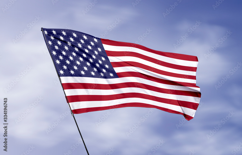 USA flag flying in wind with Coronavirus (covid-19) virus icon
