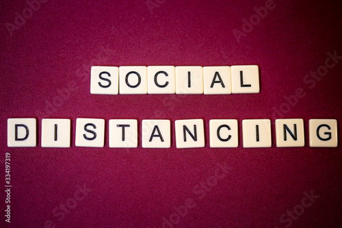 "SOCIAL DISTANCING" in letter tiles
