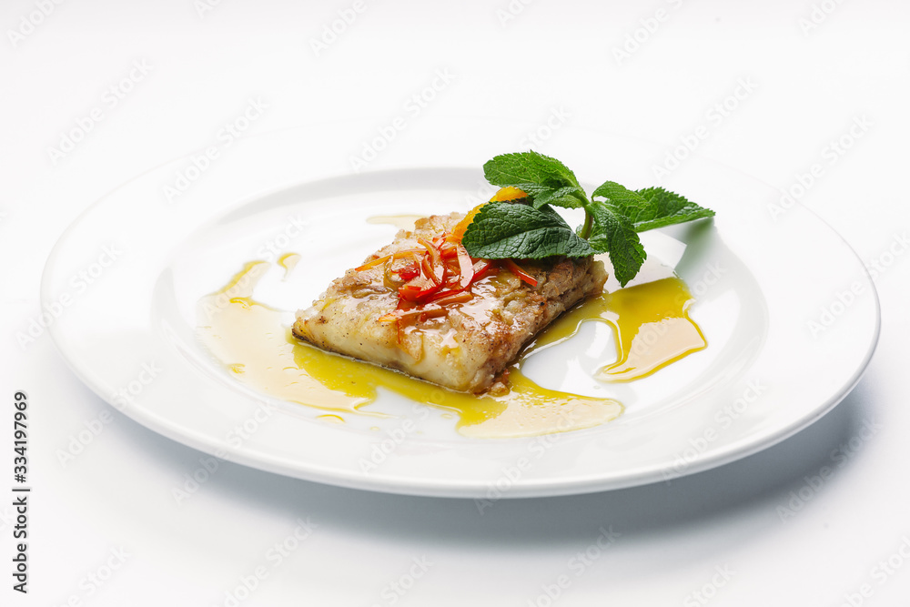 fish on a white plate