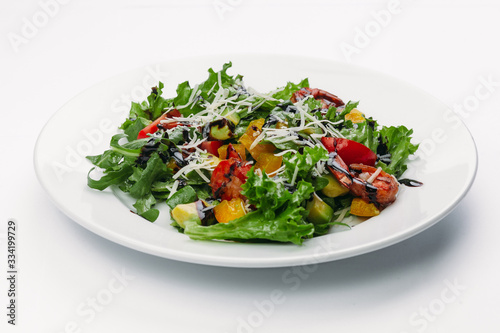 green salad on a white plate