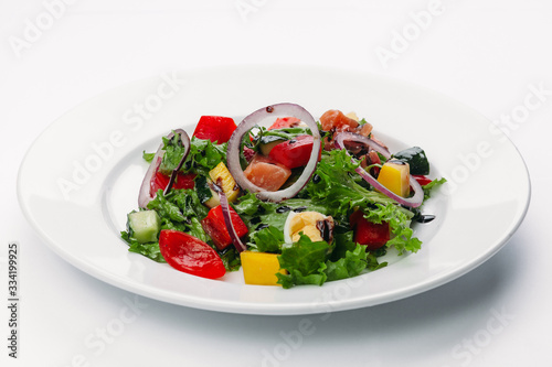 green salad on a white plate