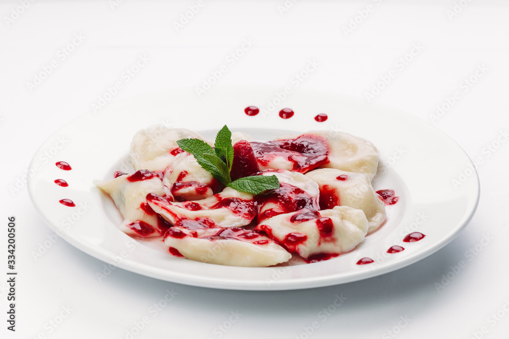 dumplings with red sauce on a white plate dumplings with red sauce on a white plate