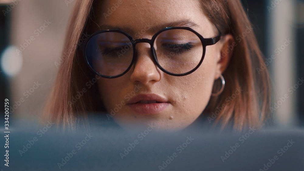 Portrait student woman reflection of light glasses focused works Internet laptop tablet female's eyes Close up woman in glasses use internet at night looking at display touchscreen computer monitor Portrait student woman reflection of light glasses focused works Internet laptop tablet female's eyes Close up woman in glasses use internet at night looking at display touchscreen computer monitor
