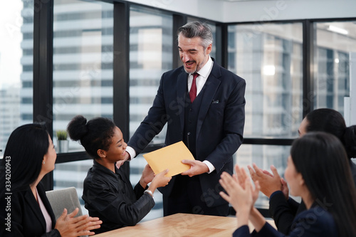 Slika na platnu Happy CEO and business team congratulating successful African American worker by clapping hands, smiling black employee excited by reward bonus promotion