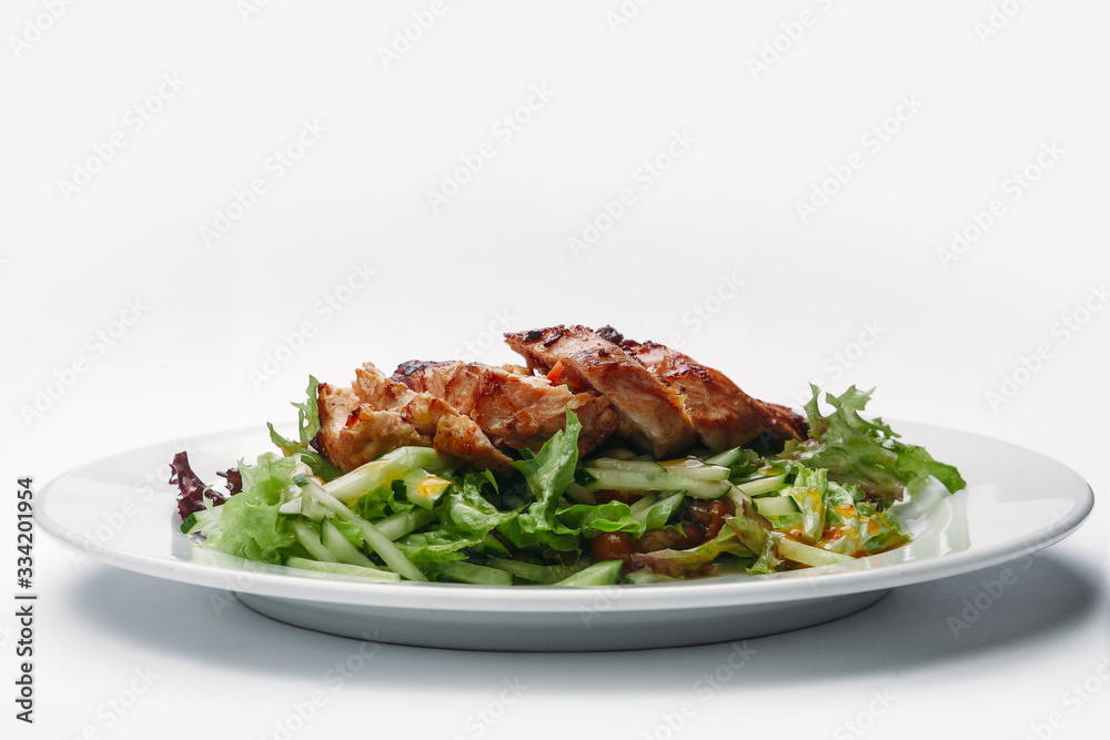 slices of sliced Turkey with salad on a white background slices of sliced Turkey with salad on a white background