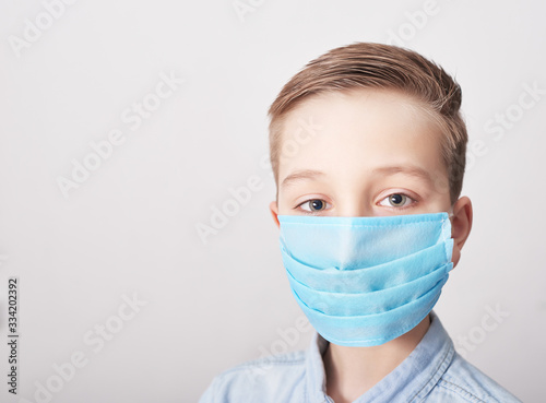 Child in medical mask. Coronavirus and Air pollution pm2.5 concept. Virus symptoms. Concept of epidemic  influenza  protection from disease  vaccination. Flu illness. Medical care. Insurance.