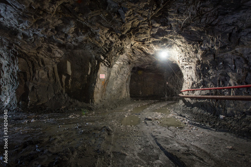 Underground gold quartz mine shaft tunnel drift with light