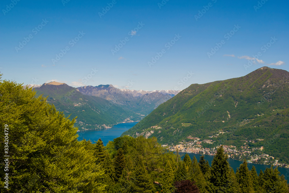 View of the Parco San Grato in Lugano, Switzerland. Alpine mountain scenery on a sunny summer day and views of Lake Lugano. 