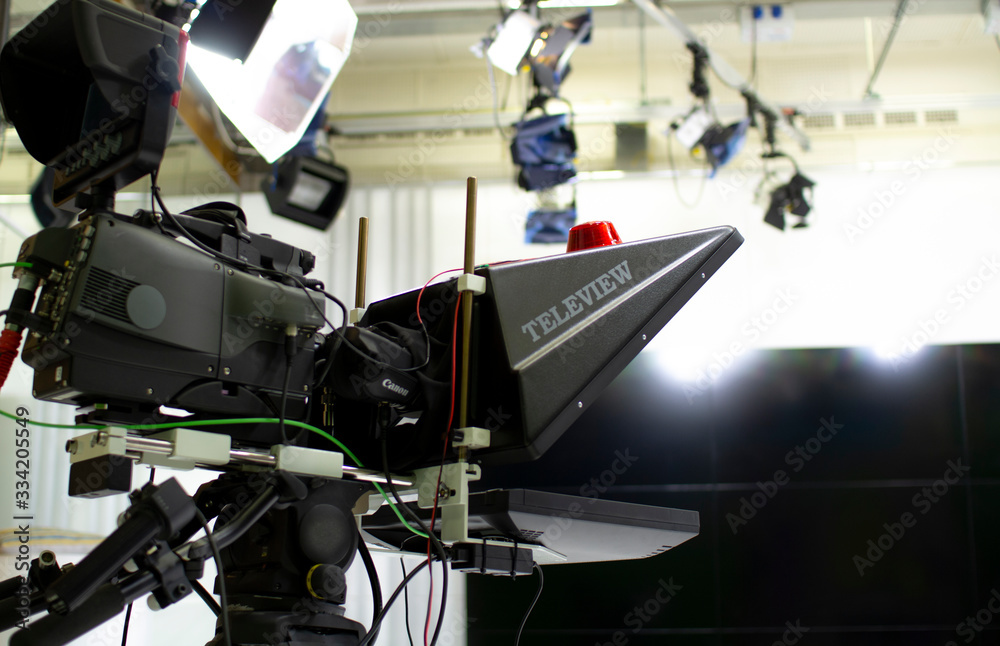 TV camera in the Studio. Teleprompter and professional high-definition video camera on a tripod.