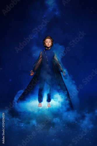 Fantastic picture. boy flying in the air. the idea is taken from the story "Little Prince"