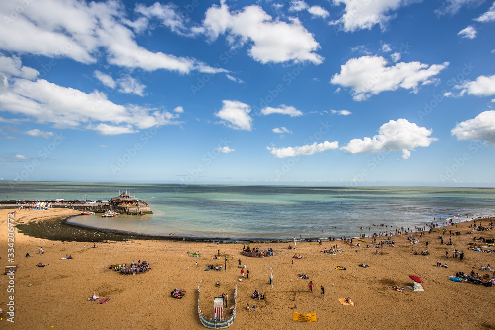 Golden sand of Viking Bay Broadstairs, Thanet, Kent, UK and the historic Bleak House on a sunny summer day.Broadstairs Kent England.June 28 2018 Golden sand of Viking Bay Broadstairs, Thanet, Kent, UK and the historic Bleak House on a sunny summer day.Broadstairs Kent England.June 28 2018