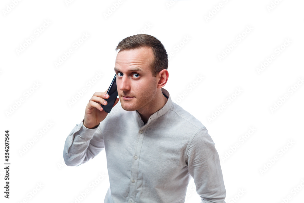 Caucasian man businessman, teacher mentor, talking on the phone and makes a selfie. He is wearing a shirt. Emotional portrait. Isolated on white background Caucasian man businessman, teacher mentor, talking on the phone and makes a selfie. He is wearing a shirt. Emotional portrait. Isolated on white background
