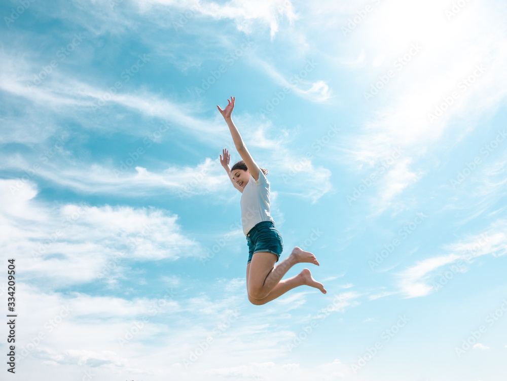 teenage girl jumping very high, active life concept