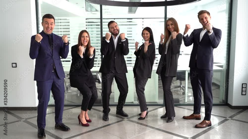 A successful corporate team of partners and colleagues, winners, are thrilled to win,slow motion A successful corporate team of partners and colleagues, winners, are thrilled to win,slow motion