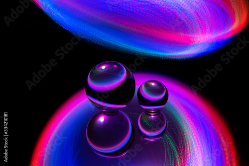 Abstract image of glass spheres under neon lights photo