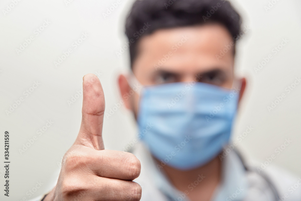 Doctor in a white coat, white gloves holds textile disposable medical masks. epidemic virus outbreak concept Doctor in a white coat, white gloves holds textile disposable medical masks. epidemic virus outbreak concept