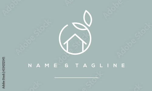 A line art icon logo of a house / home with a leaf circle  photo