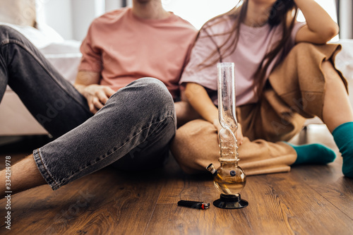 Obraz na plátne caucasian couple catch a buzz from using cannabis, marijuana