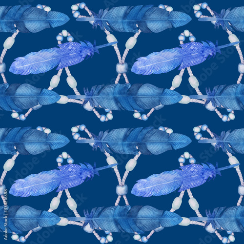 Seamless pattern with hand drawn watercolor illustration. Feathers in blue tones are perfect as print for fabric or wrapping paper.