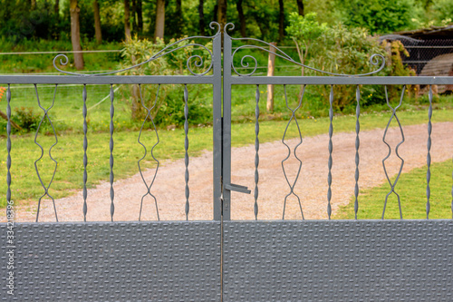 Forged grey metal protection gate.