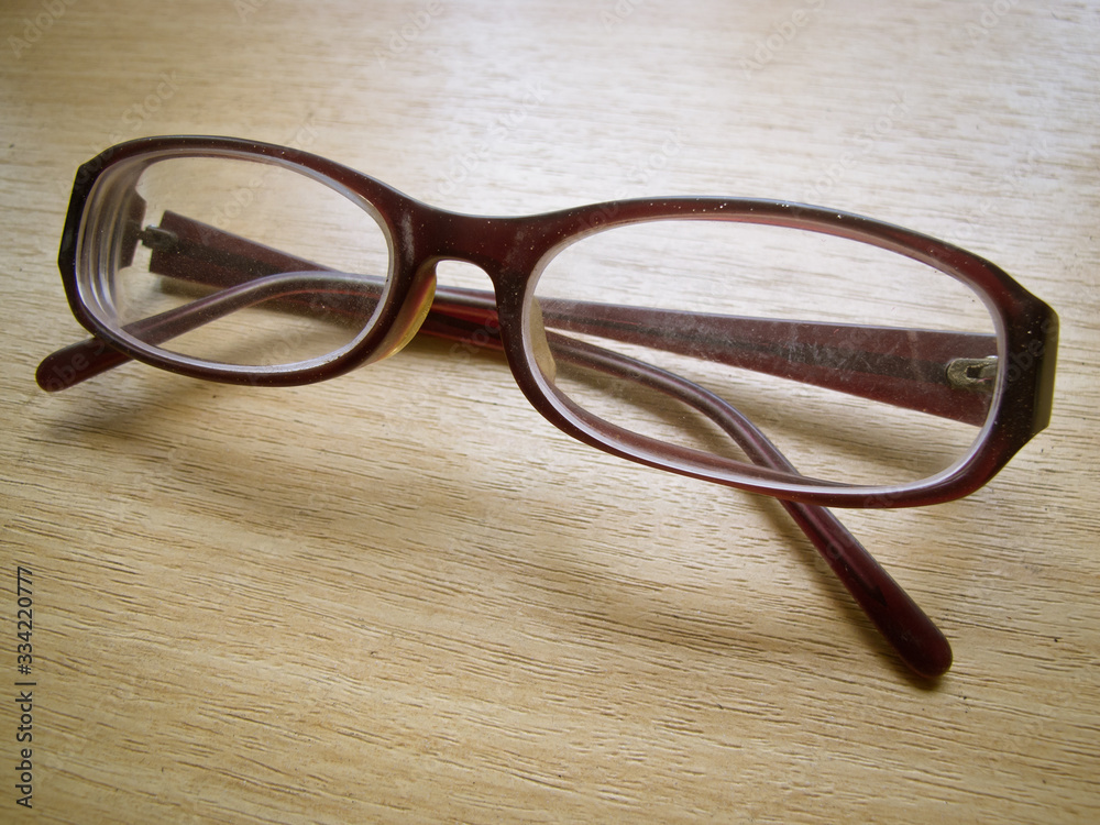 A retro style glasses on a wooden table A retro style glasses on a wooden table