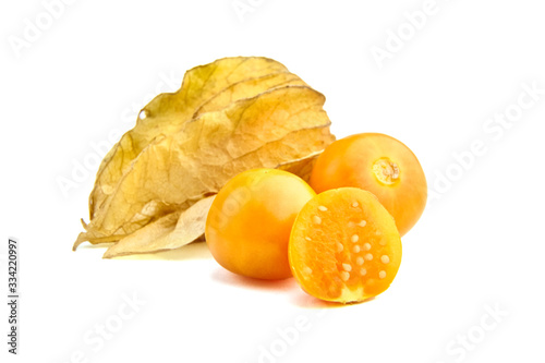 Physalis, whole and halved goldenberries isolated on a white background photo