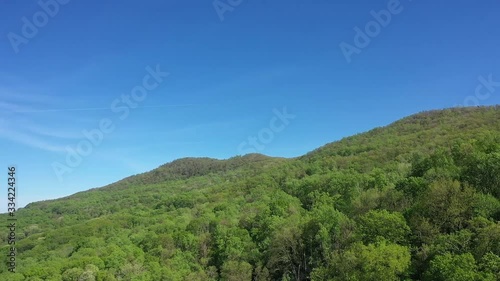 Aerial of Waterfalls in a lush green forest during spring at Melrose Falls In Saluda, NC Western North Carolina