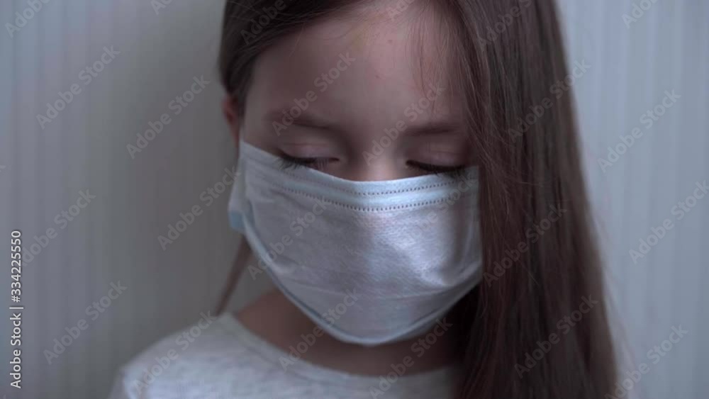 Baby in coronavirus. World pandemic concept COVID 19. Little girl in a protective medical mask. Copy space Baby in coronavirus. World pandemic concept COVID 19. Little girl in a protective medical mask. Copy space