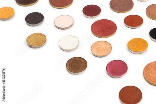 Round multicolored make up eyeshadows isolated on white.