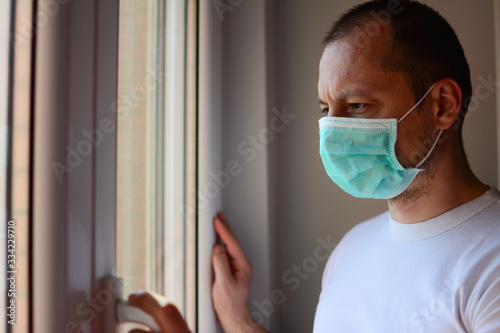 Man quarantined coronavirus in protective masks. New reality. Normal life in isolation. Italy, Spain, europe covid-19. Patient isolated to prevent infection. Pandemia.