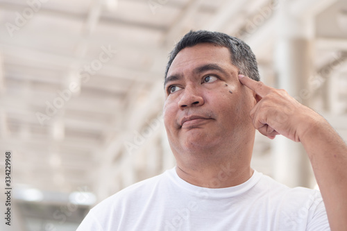 Photography smart thoughtful asian old senior man thinking, planning; portrait of senior unc