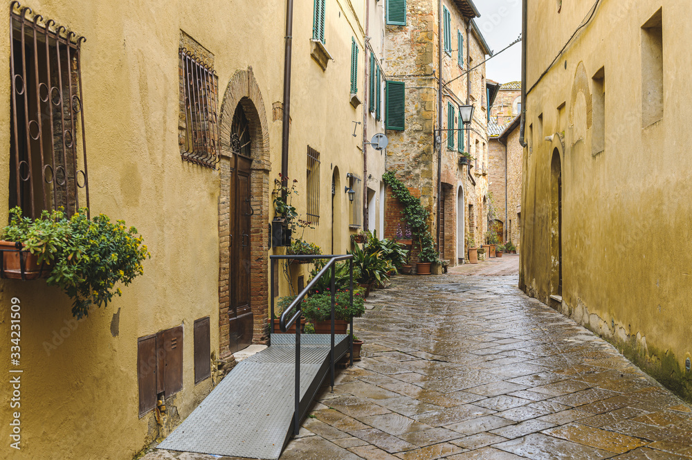 Fototapeta premium Walk on a rainy day through the streets of the beautiful town, Pienza, Tuscany