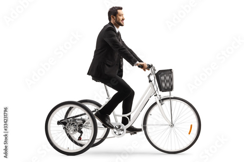 Businessman riding a tricycle