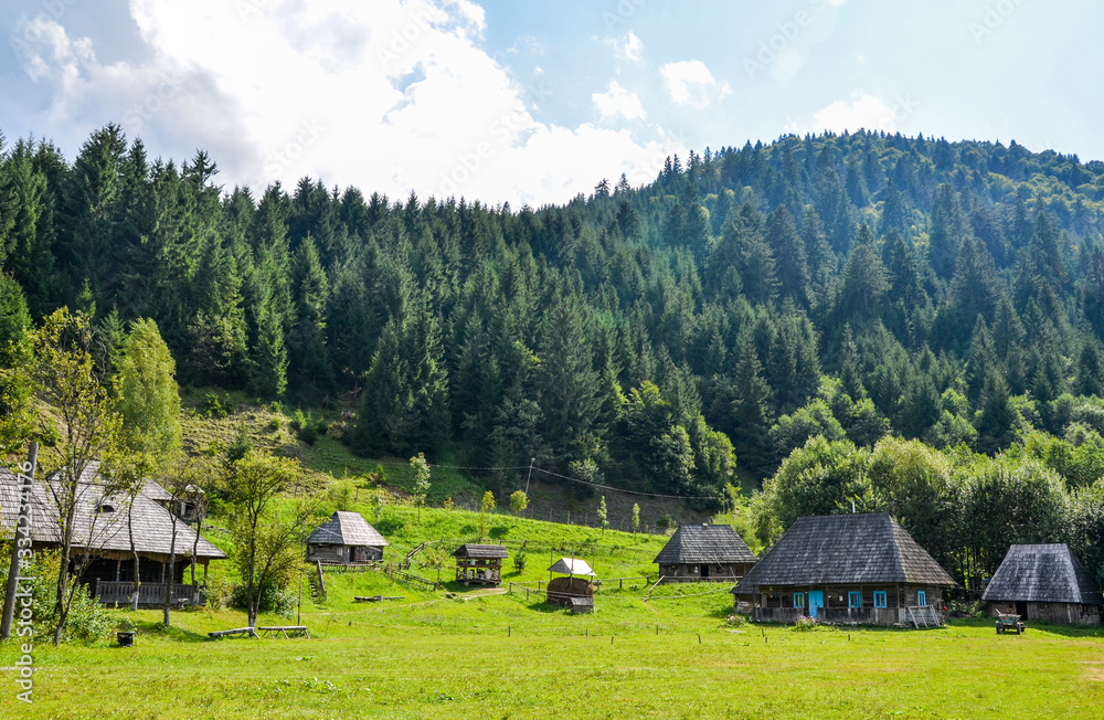 Rural landscape of ancient old wooden houses  in the traditional style in the mountain village  Kolochava, Transcarpathia, Ukraine