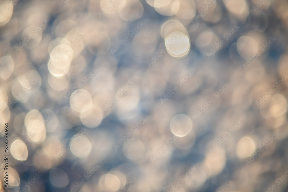 Abstract background of soft creamy bokeh circles.