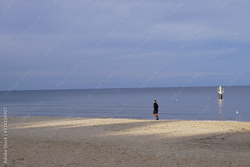  A man walking on the beach