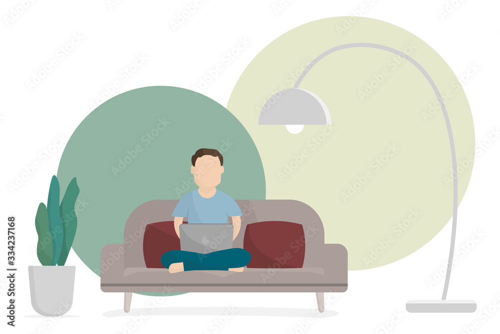 Man working with laptop on sofa at home. Work from home concept.