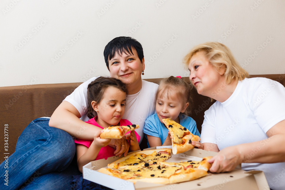 Family Eating Pizza Together at home