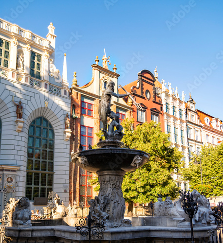 Gdansk, Poland - Jun 21, 2016: Neptune statue Dlugi Targ street in the center, Artus Court Building.