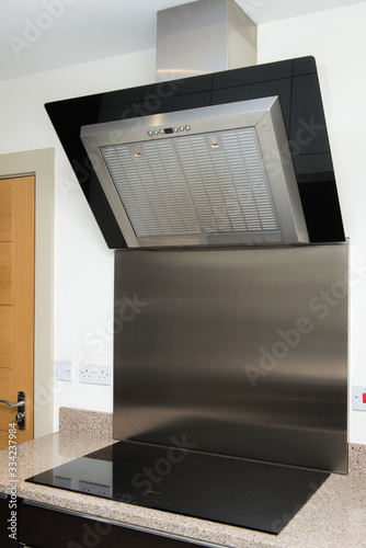 modern high standard kitchen with hob and extractor 