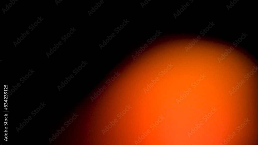 Orange light leaks, lens flare, and bokeh.