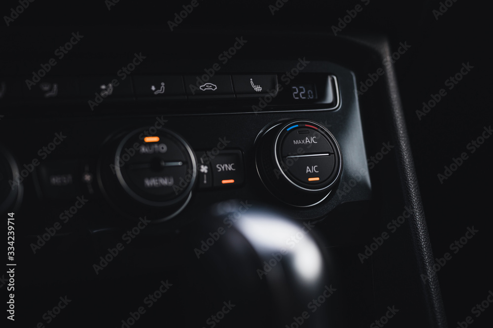 Color detail with the air conditioning button inside a car. Car interior. Car air condition. Color detail with the air conditioning button inside a car. Car interior. Car air condition.