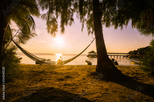 Beautiful sunset on the island of Kecil one of the two islands that form the Perhentian in Malaysia. photo