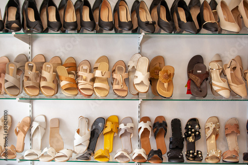 Background with shoes on shelves of shop