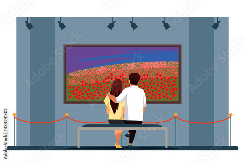 Couple admire flower field painting in art gallery