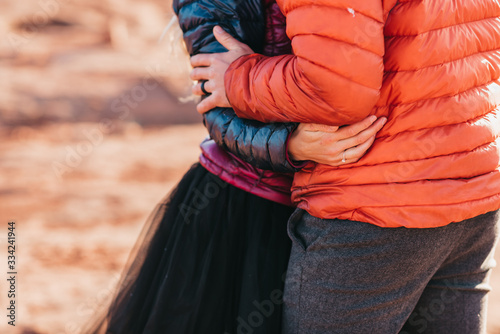 husband and wife embracing during adventure elopement photo