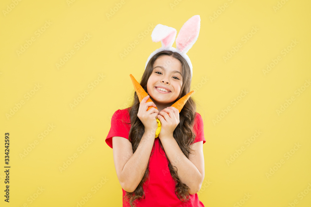 nutrition diet for health. benefit of eateing carrot. easter carrot recipes. stay healthy and happy. small girl hold carrot. child in bunny ears. I always make a healthy choice