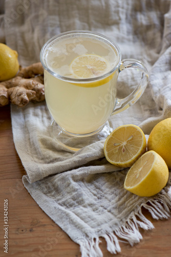 Wallpaper Mural Lemon ginger drink in dark light with a soft cloth and texture Torontodigital.ca