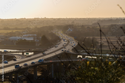 Setting sun over the Adur valley  with major road and junction running through the scene